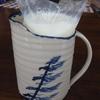 Blue windswept pine decorates this milk jug.  Holds Canadian milk bag
can be done in any Chatham Pottery glaze pattern
$75